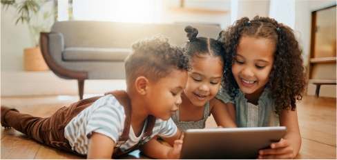 children looking at ipad