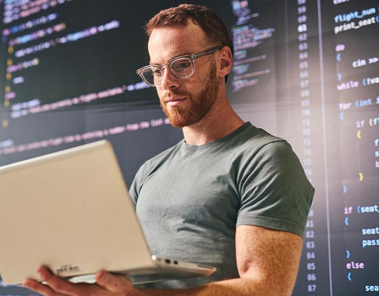 Data Engineer coding on a laptop